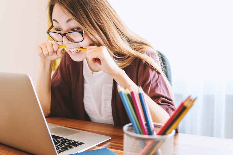 Student reading textbook and reviewing lesson notes